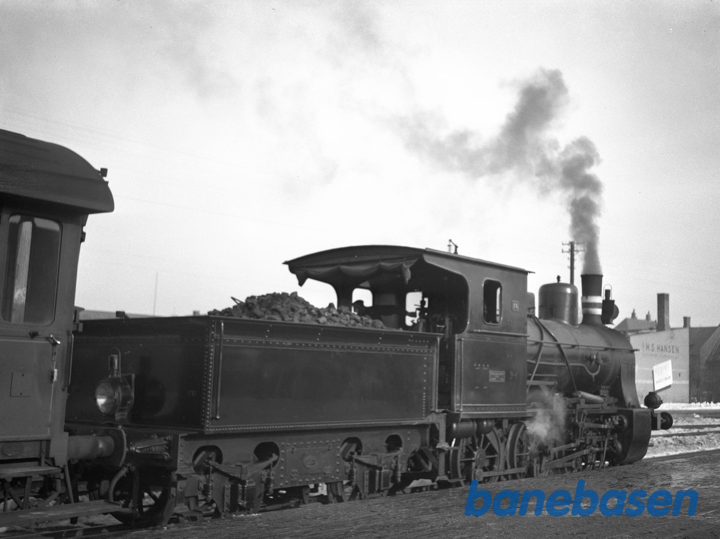 Damplokomotiv LJ 19 med tog . Set bagfra.Nakskov station Damplokomotiv LJ 19 med tog . Set bagfra.Nakskov station