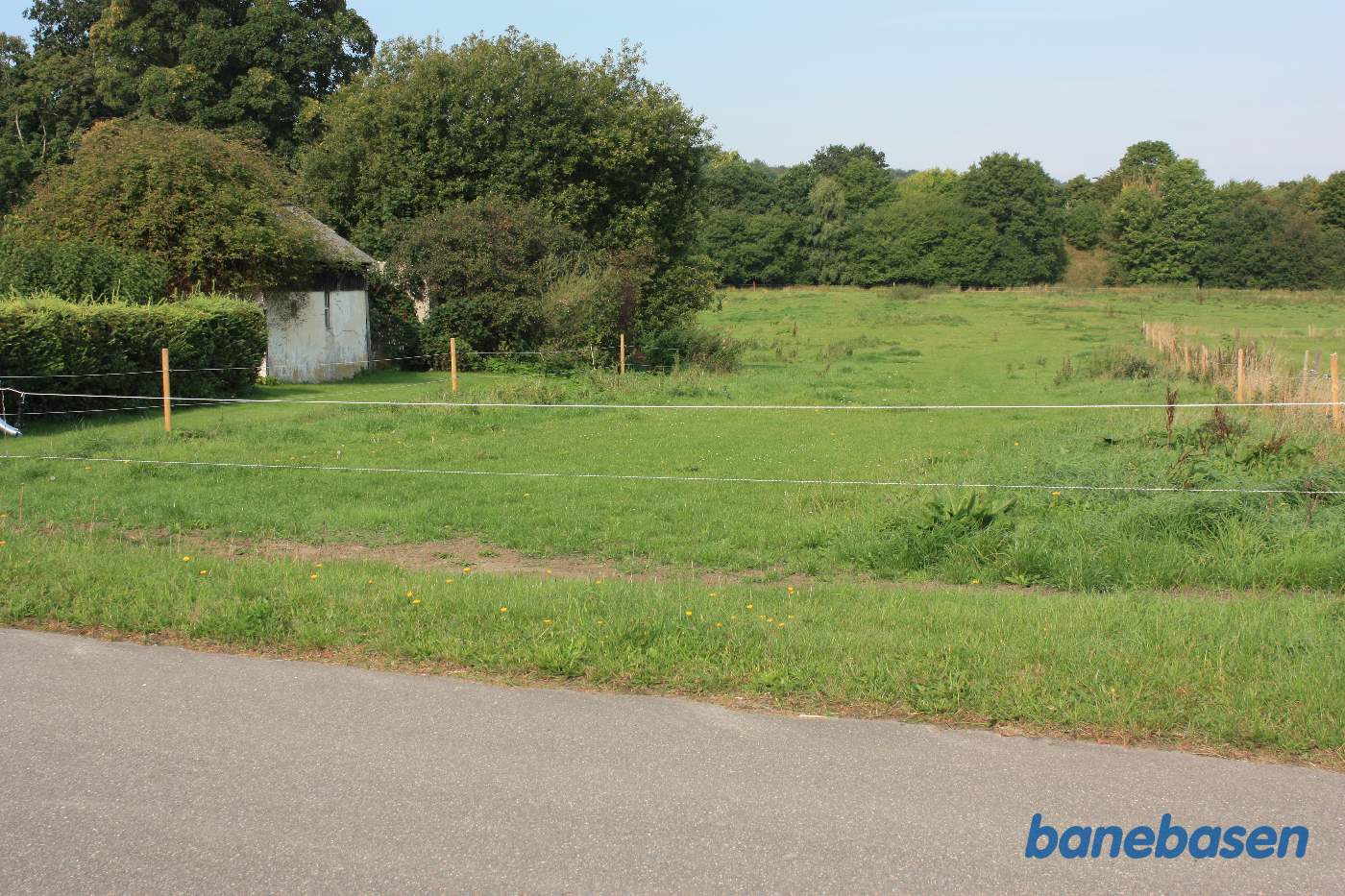 Vi står på Østerskovvej og kigger mod Toustrupmølle Vi står på Østerskovvej og kigger mod Toustrupmølle